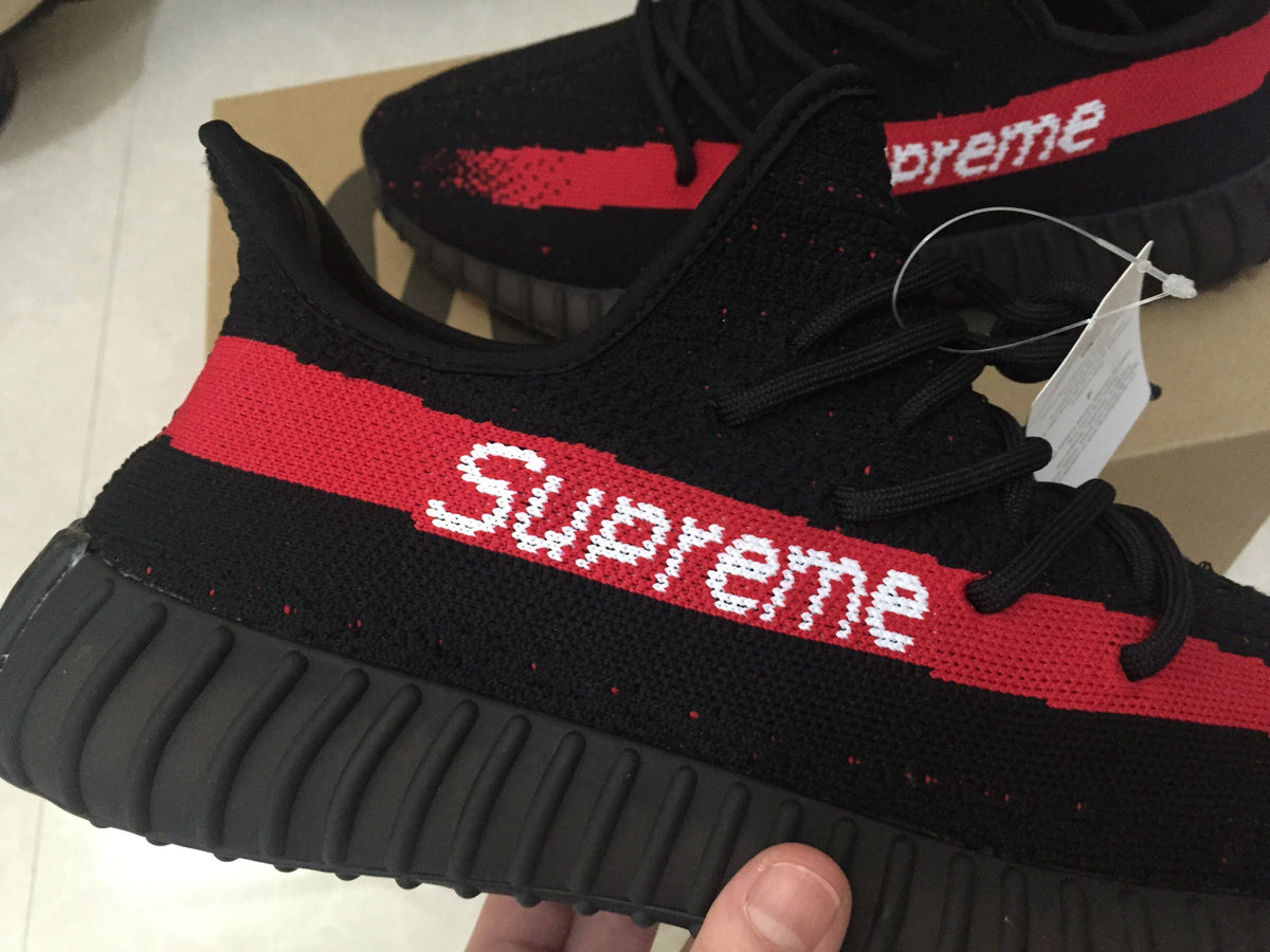 Yeezy 350 V2 Sneakers in Black and Red Knit - product image from the listing.