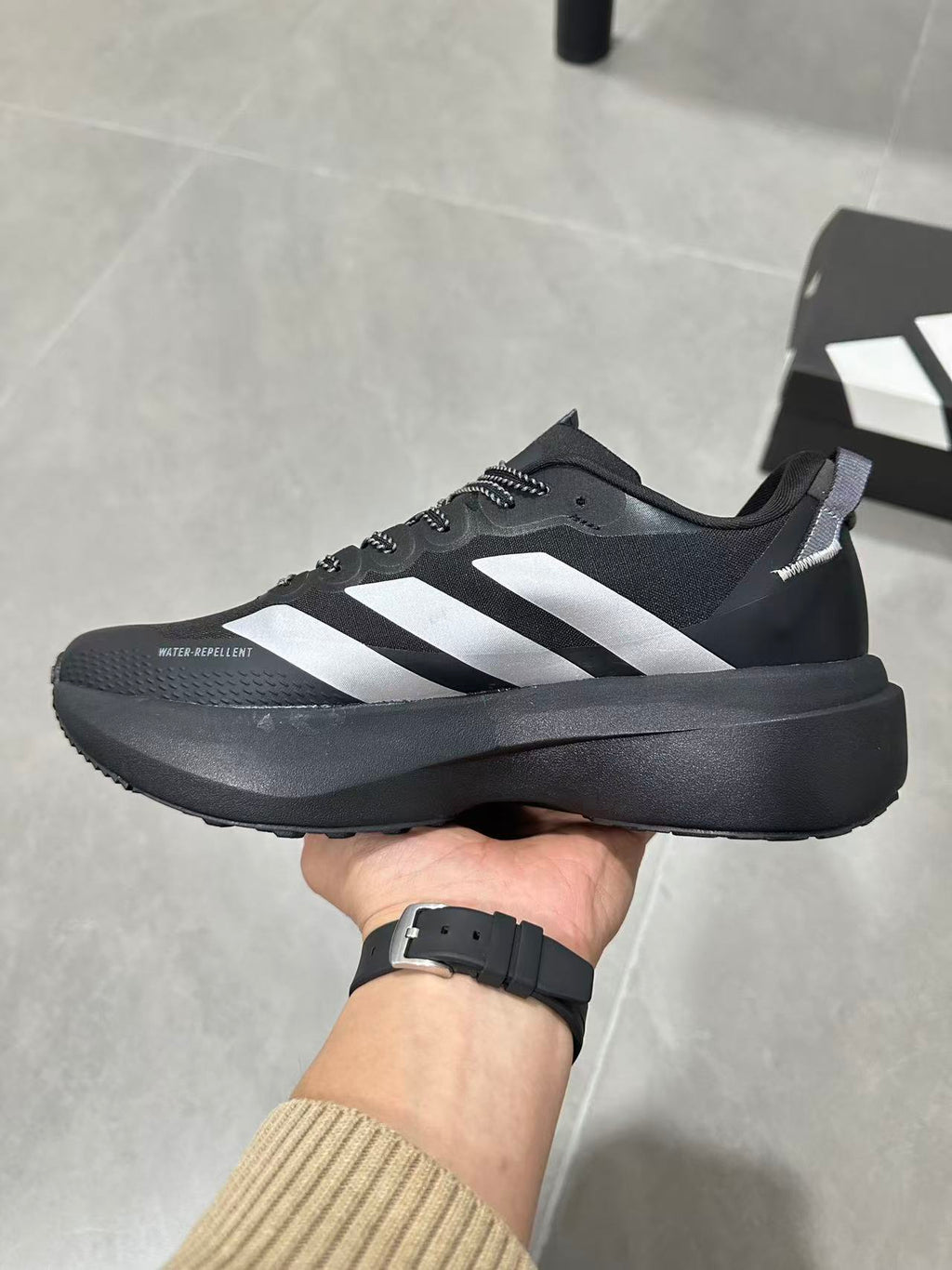 Adidas Lightstrike Pro Black Shoes for Running with White Stripes - product image from the listing.