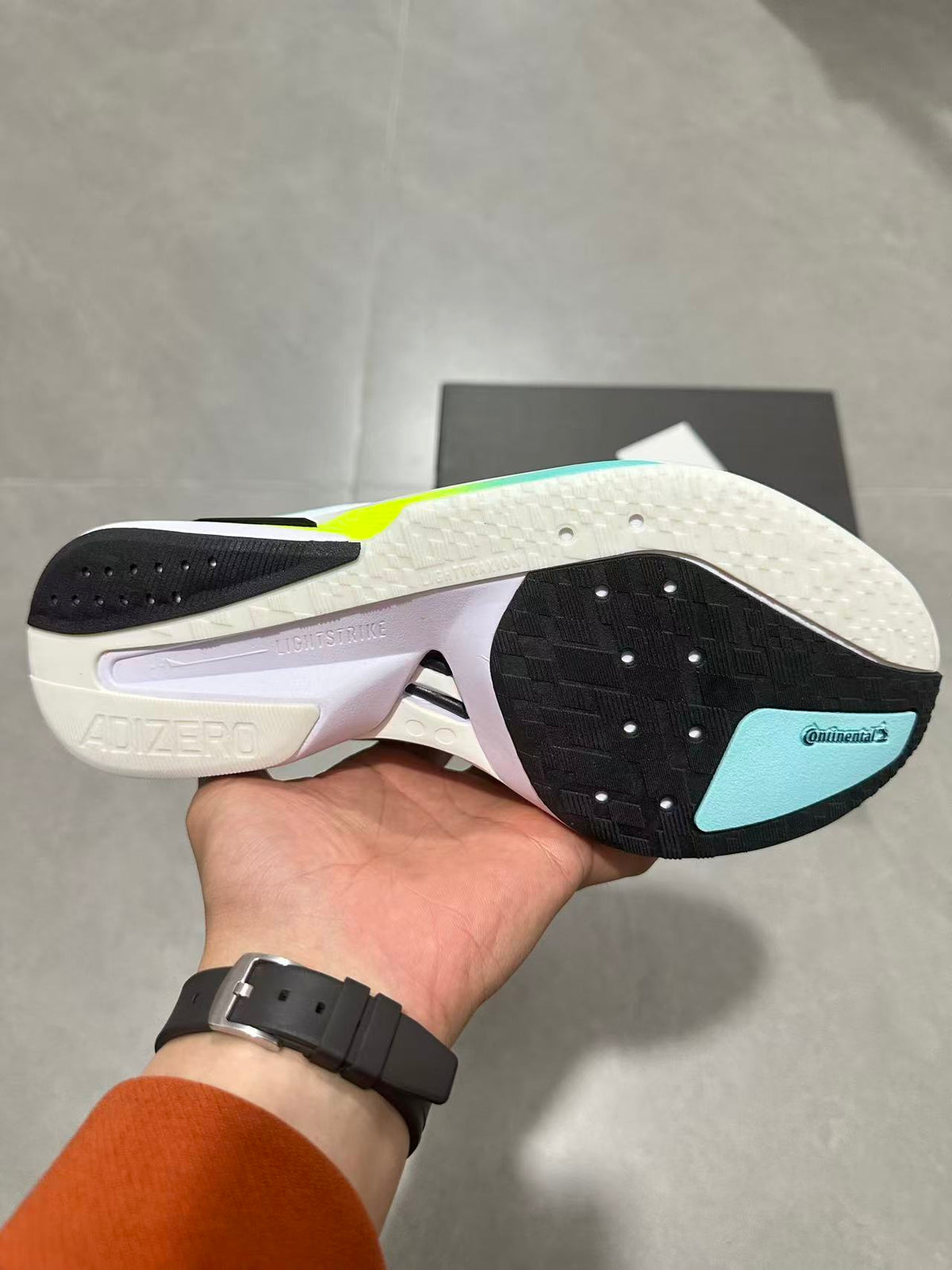 adidas Adizero Lightstrike Pro Running Shoes, in Mint and Black - product image from the listing.