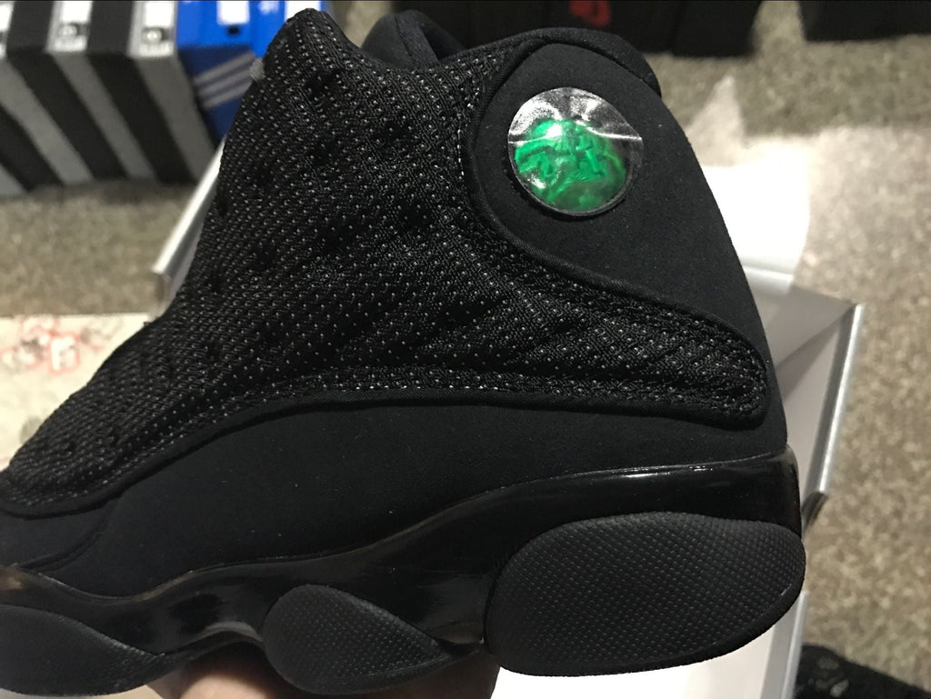 Air Jordan 13 Retro Black Cat Basketball Sneakers in Black - product image from the listing.