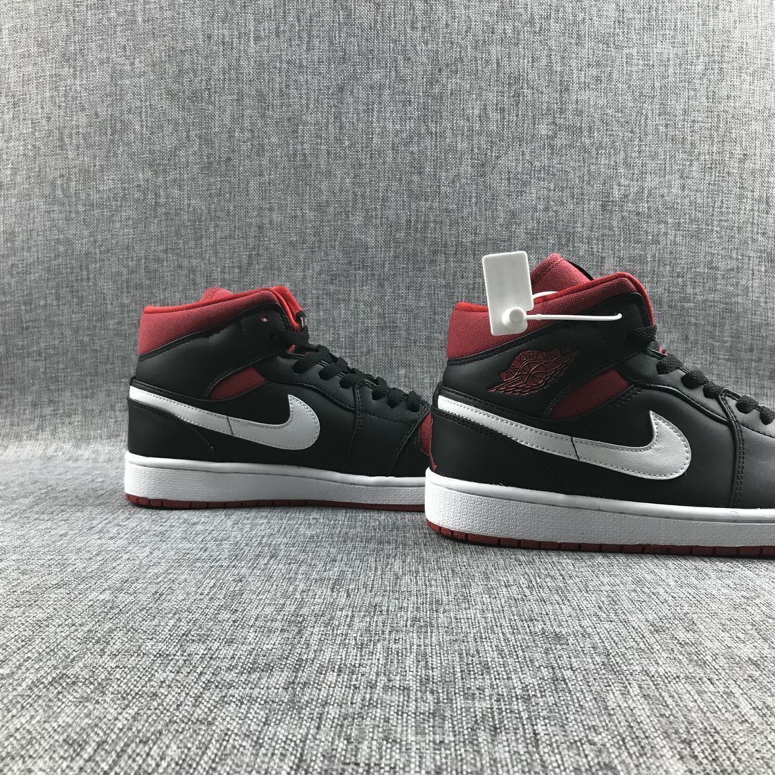 Black Red Canvas-Style Sneakers - Jordan 1 Mid 554724-020 - product image from the listing.