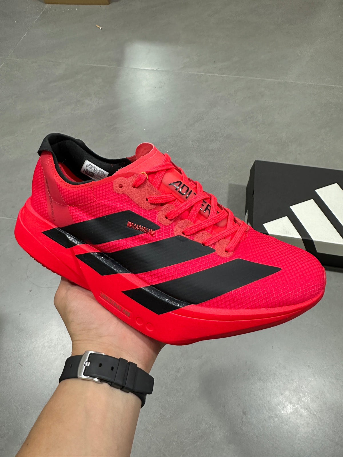 Nike Adizero Evo SL Running Shoes in Red Black JR6356 - product image from the listing.