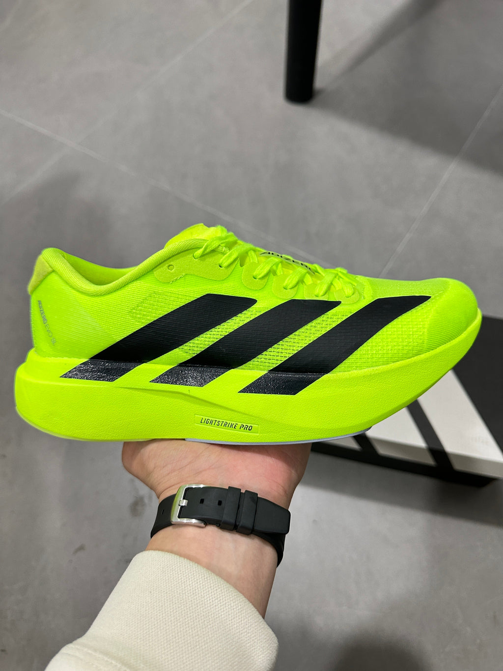 Adidas Adizero Lightstrike Pro Running Shoes, Neon in Green - product image from the listing.