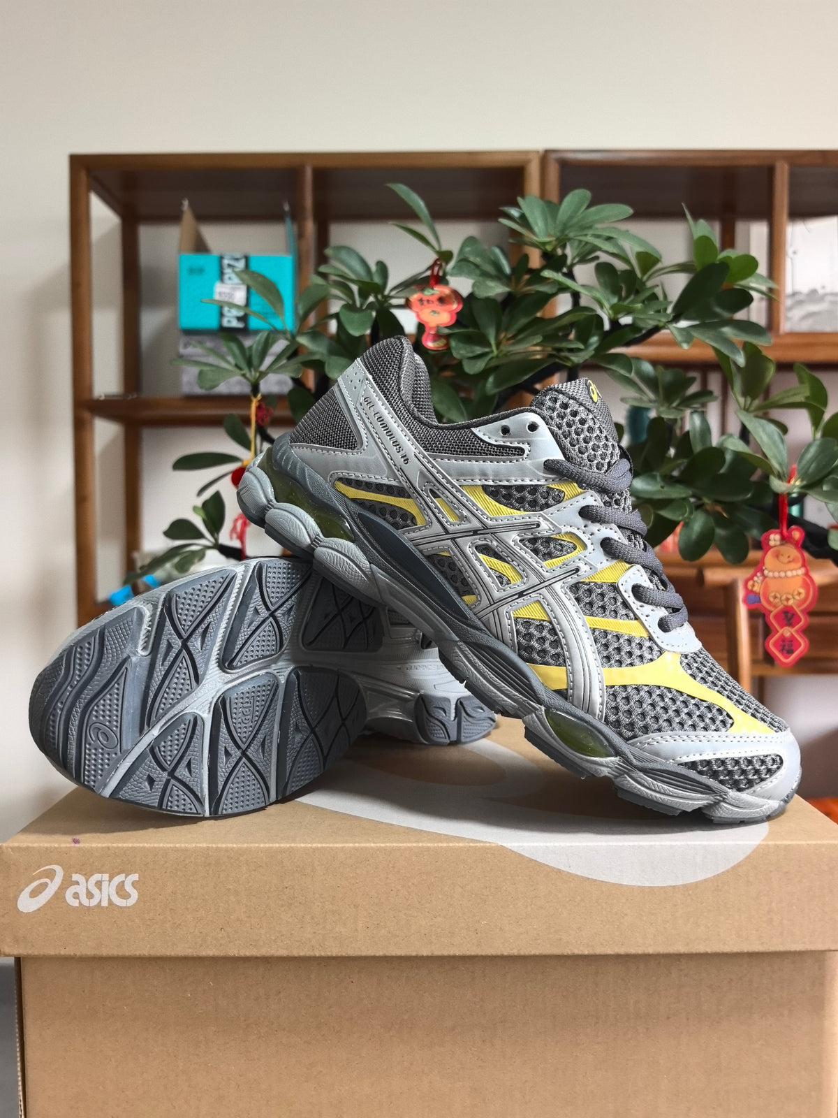 ASICS GEL-KAYANO 16 Sneakers in Gray Silver Yellow - product image from the listing.