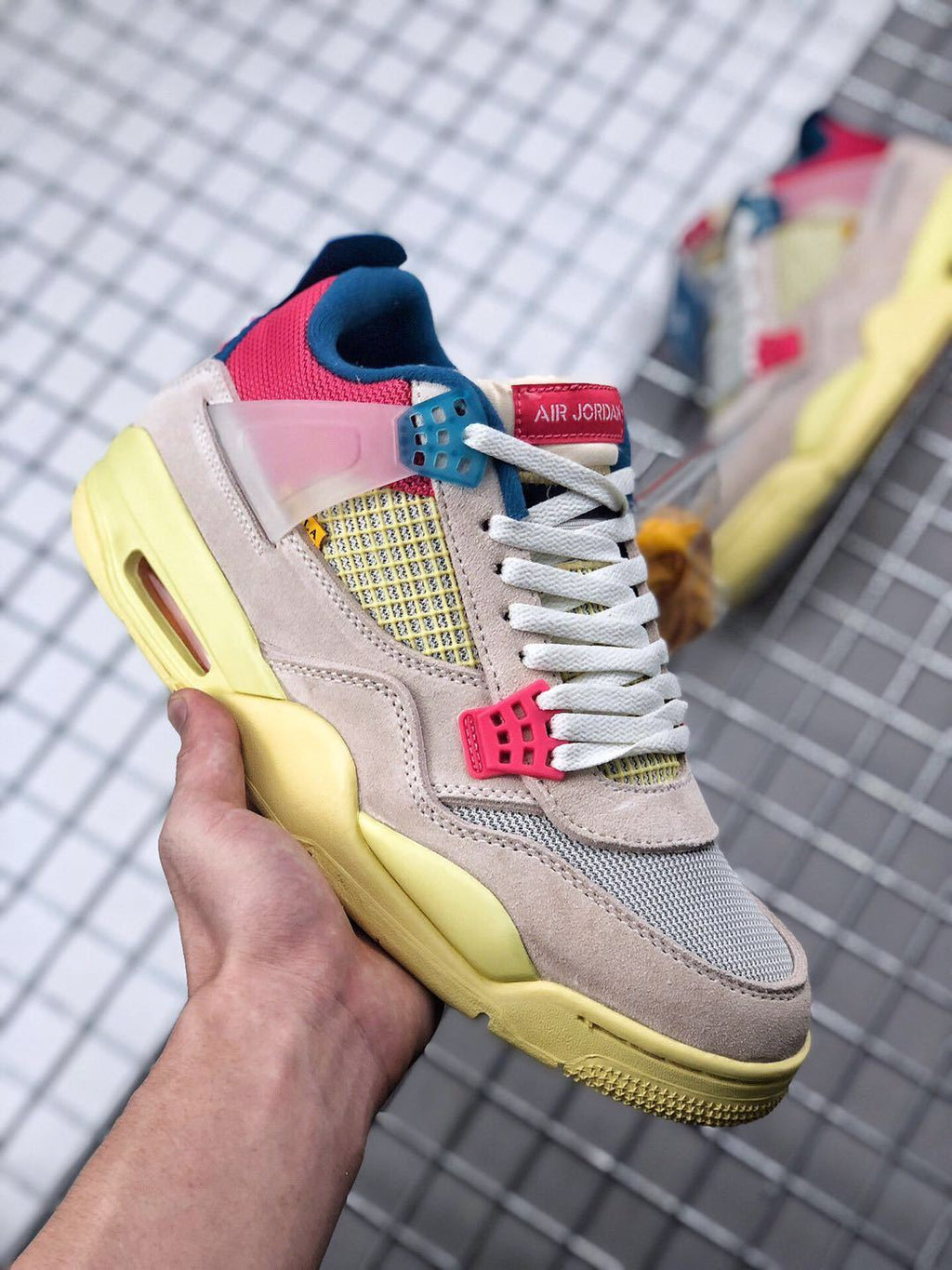 Union x Air Jordan 4 Sneakers in Pink Beige Navy Yellow - product image from the listing.