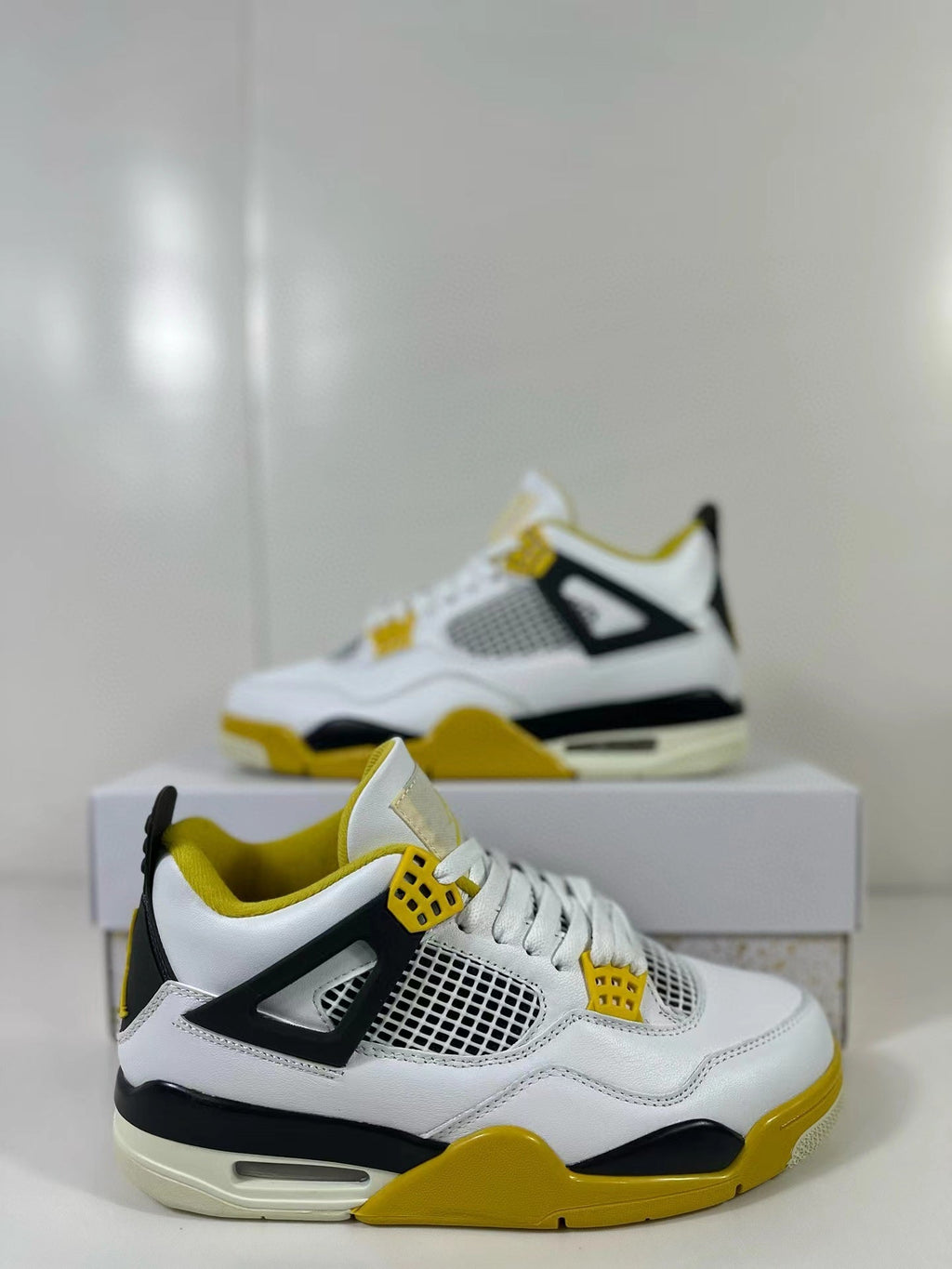 Air Jordan 4 Vivid Sulfur Sneakers White Yellow AQ9129-101 - product image from the listing.