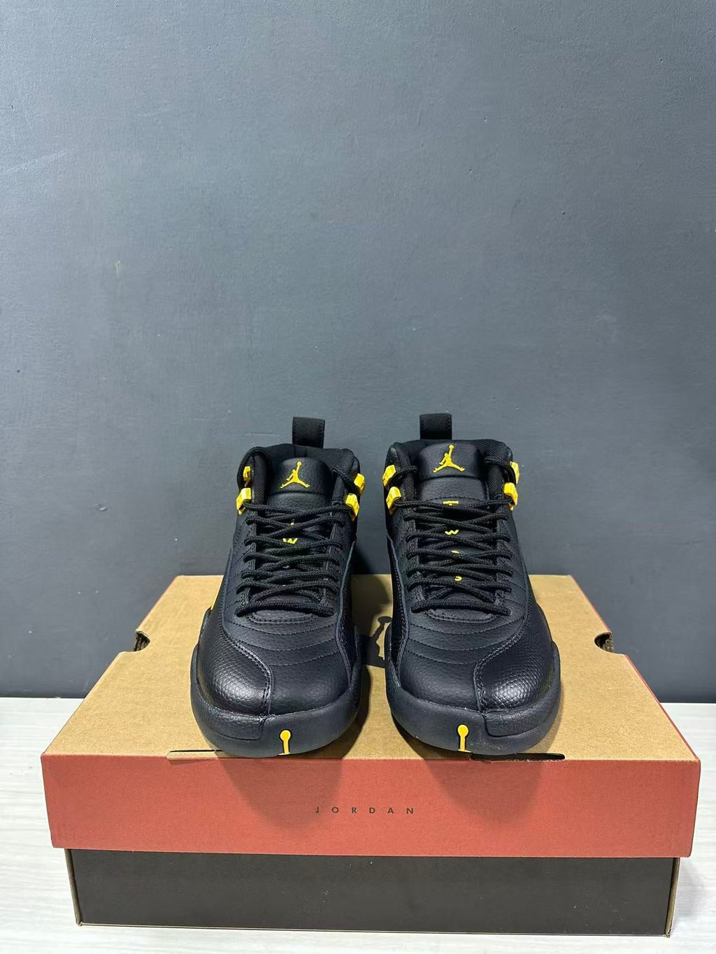 Air Jordan 12 Retro Black Taxi Sneakers CT8013-071 - product image from the listing.