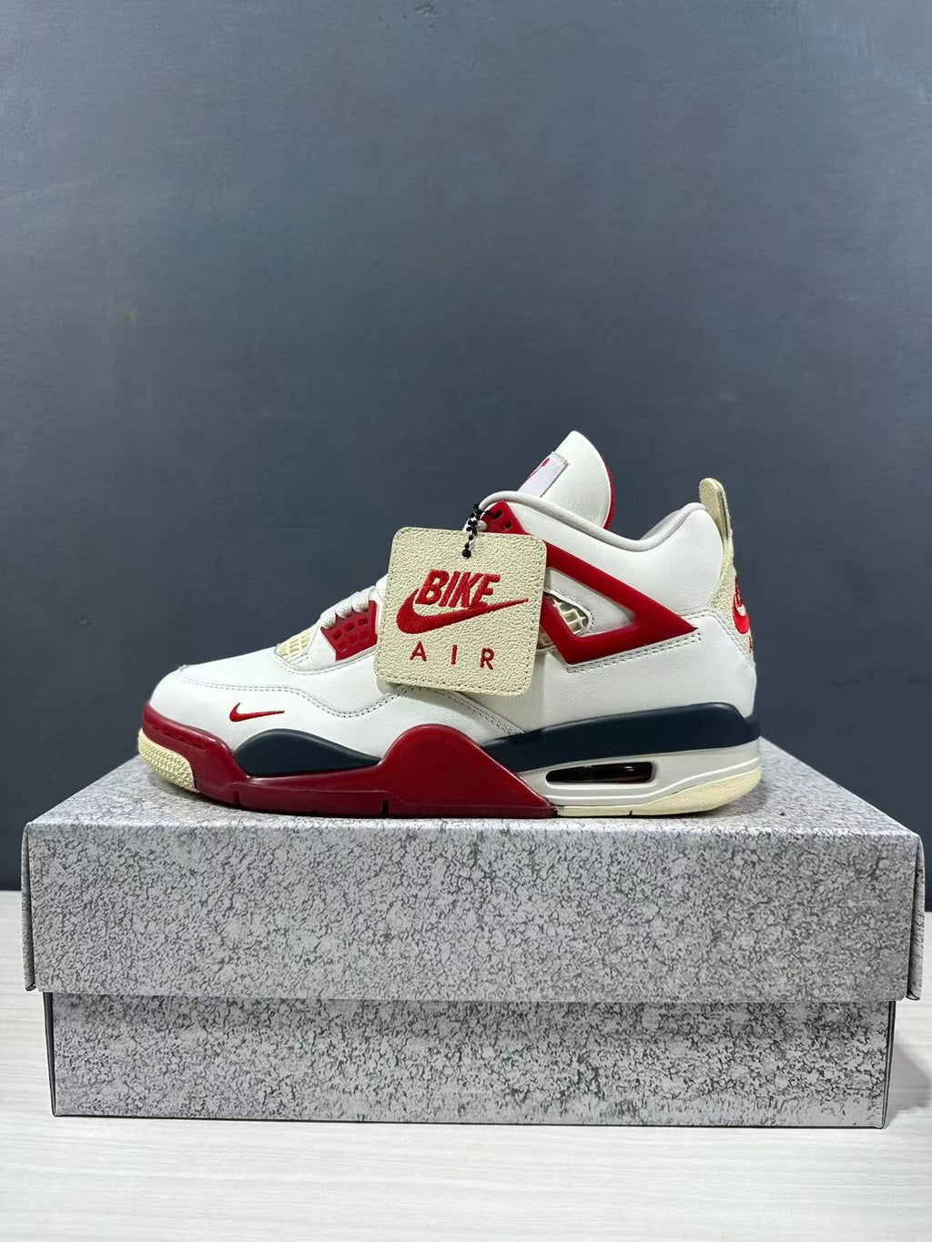 Air Jordan 4 Retro White Red Sneakers - product image from the listing.