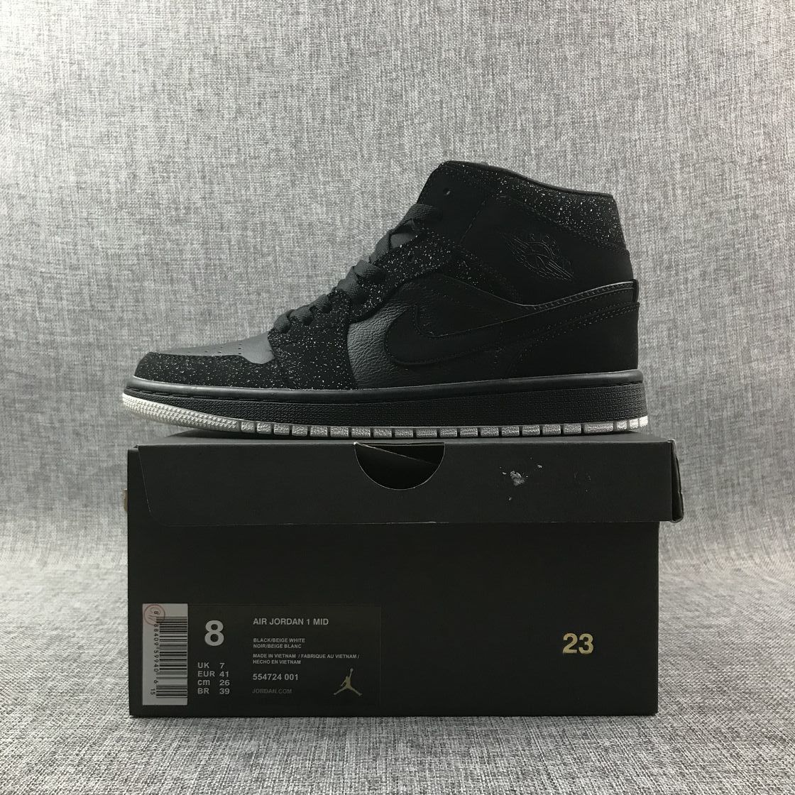 Air Jordan 1 Mid Black and White Sneakers 554724-001 - product image from the listing.