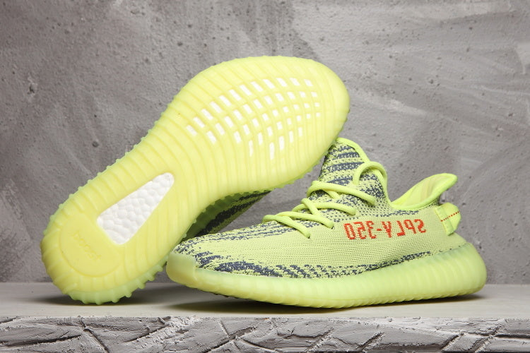Lime Green and Charcoal Yeezy Boost 350 V2 Sneakers - product image from the listing.