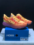 HOKA Speedgoat 6 Trail Running Shoes, in Orange and Yellow - product image from the listing.
