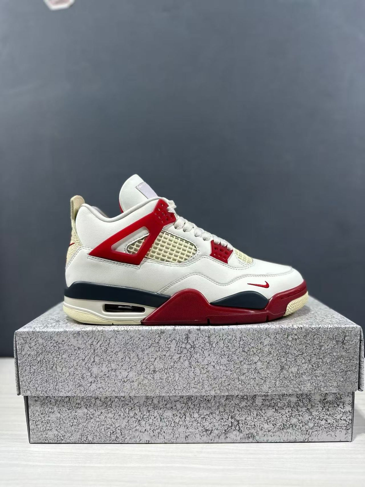 Air Jordan 4 Retro White Red Sneakers - product image from the listing.