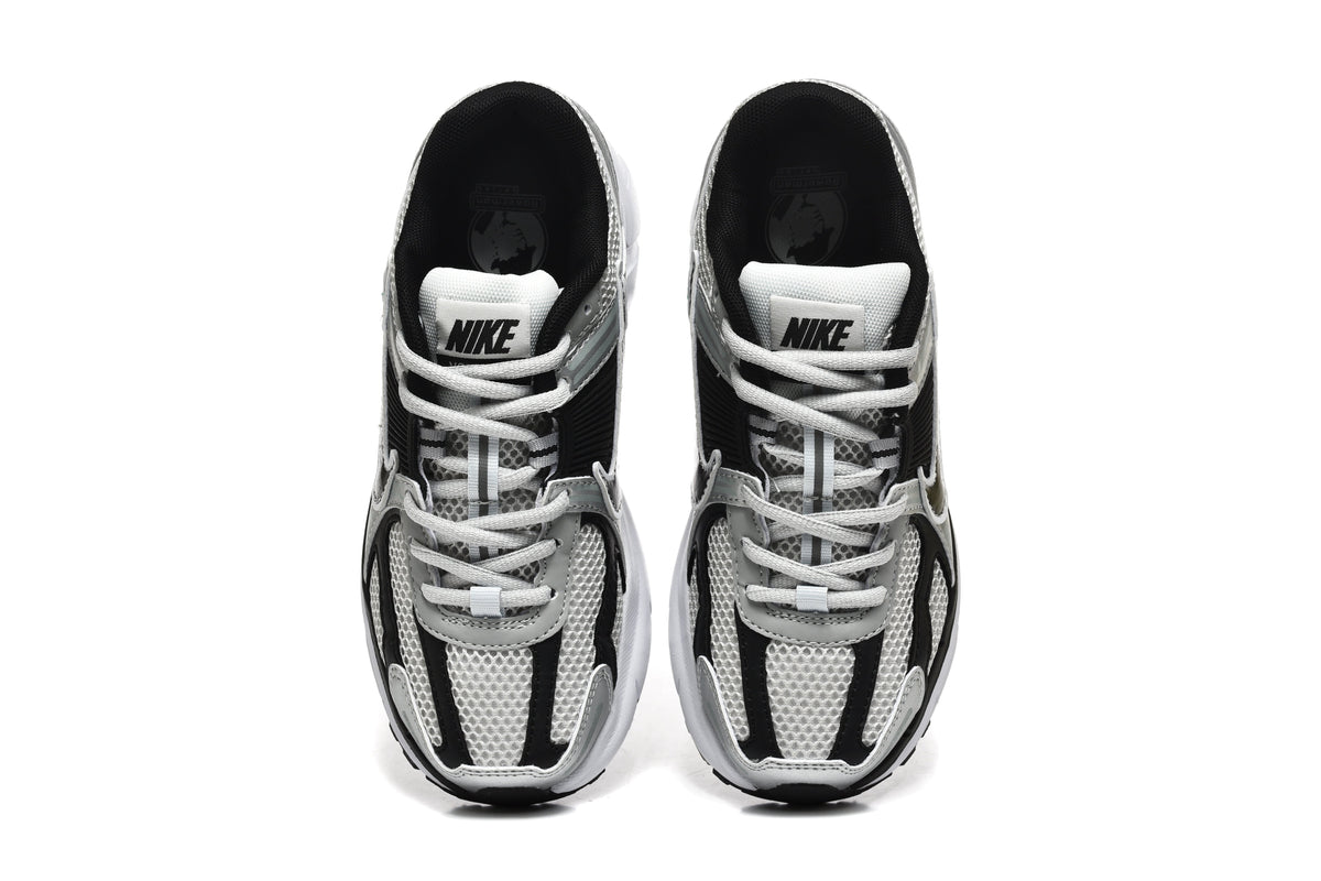 Nike Silver and Black Mesh Trainers - product image from the listing.