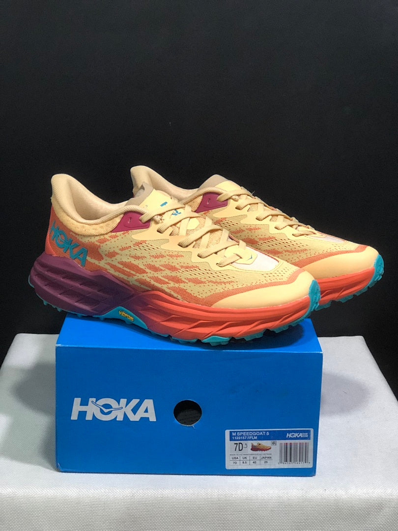 Yellow and Coral HOKA Speedgoat 5 Trail Running Shoes - product image from the listing.