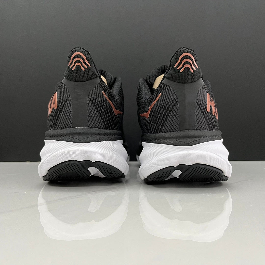 HOKA Clifton 9 Running Shoes in Black and Gold - product image from the listing.