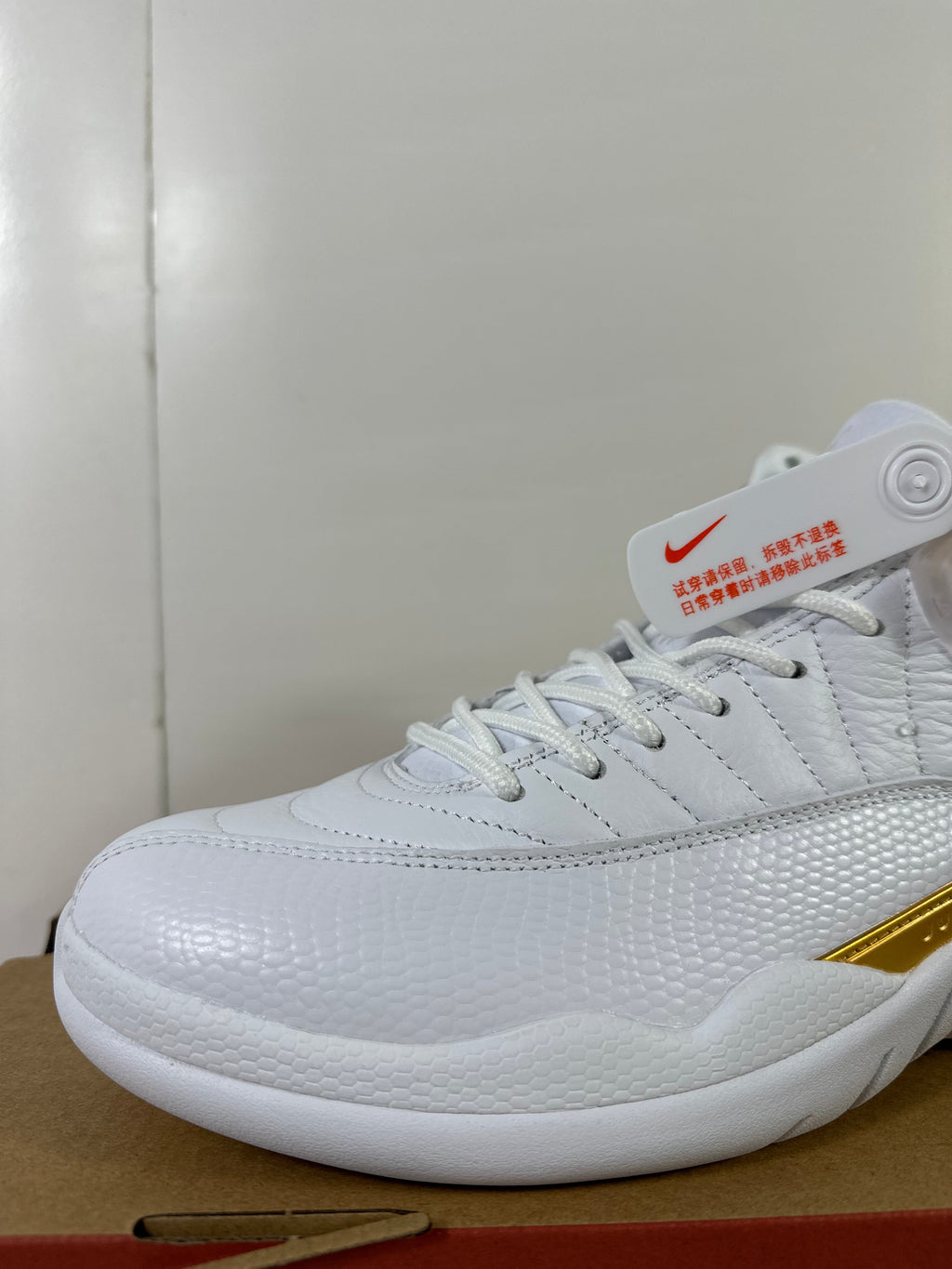 Air Jordan 12 Phantom White Metallic Gold Sneakers FD9101-007 - product image from the listing.