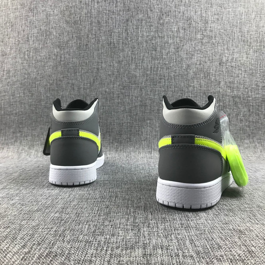 Air Jordan 1 Mid Sneakers in Grey Volt 554724-072 - product image from the listing.