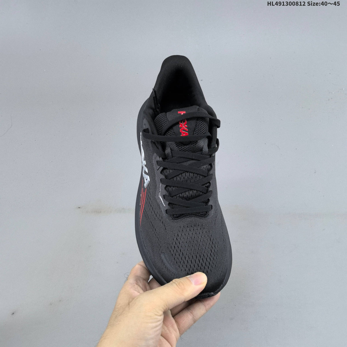 HOKA Clifton 11 Black Shoes for Running with Red Accents - product image from the listing.