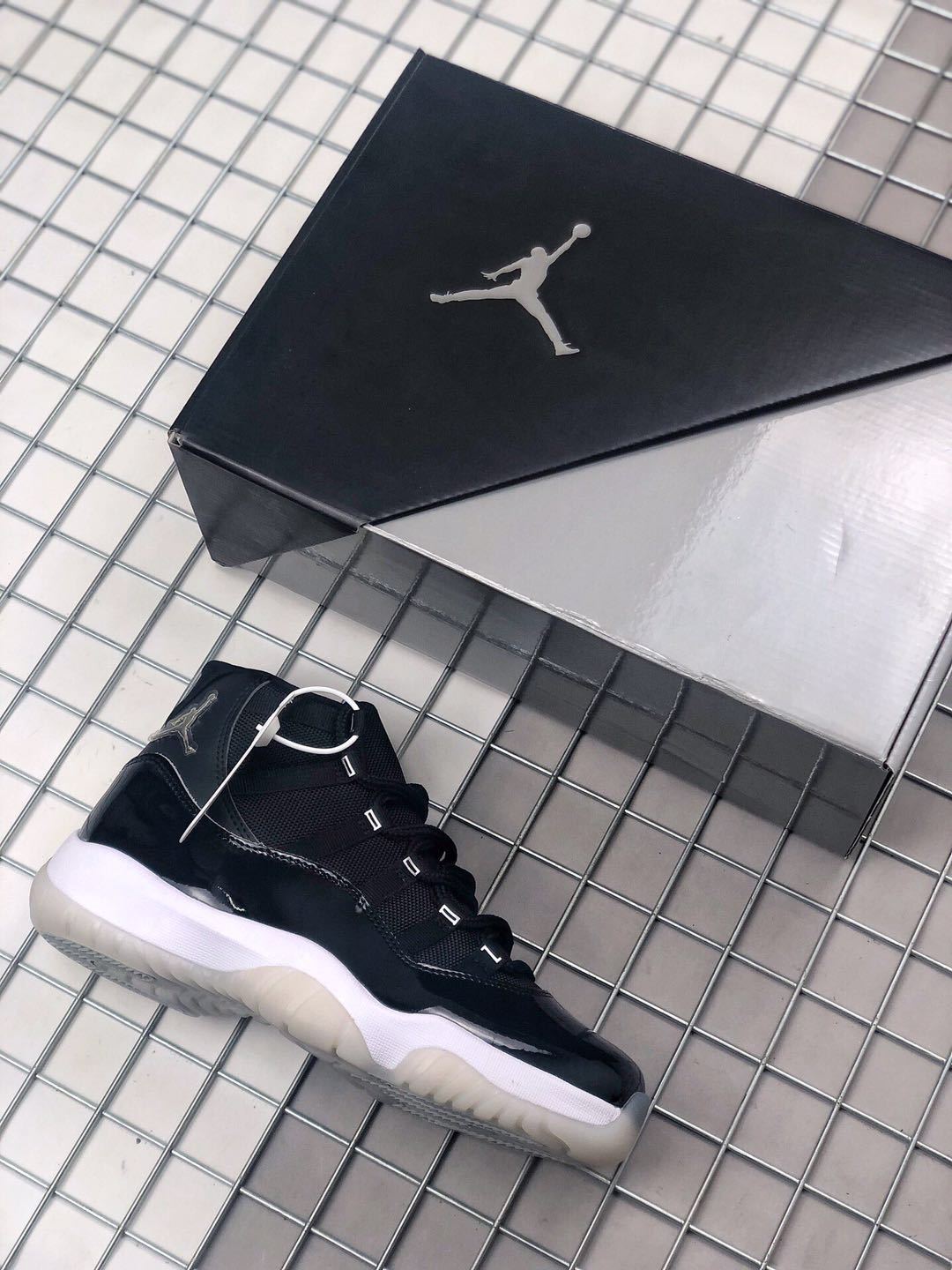 Air Jordan 11 Silver Eyelets Black White Sneakers - product image from the listing.