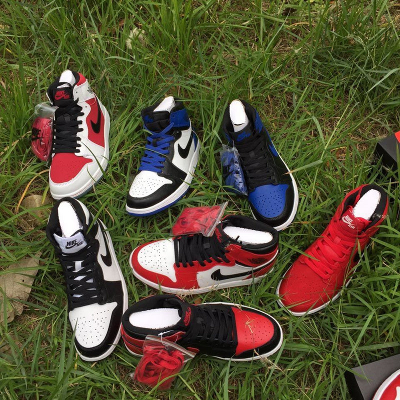 Jordan 1 High Sneakers in Black, in White and Royal Blue - product image from the listing.