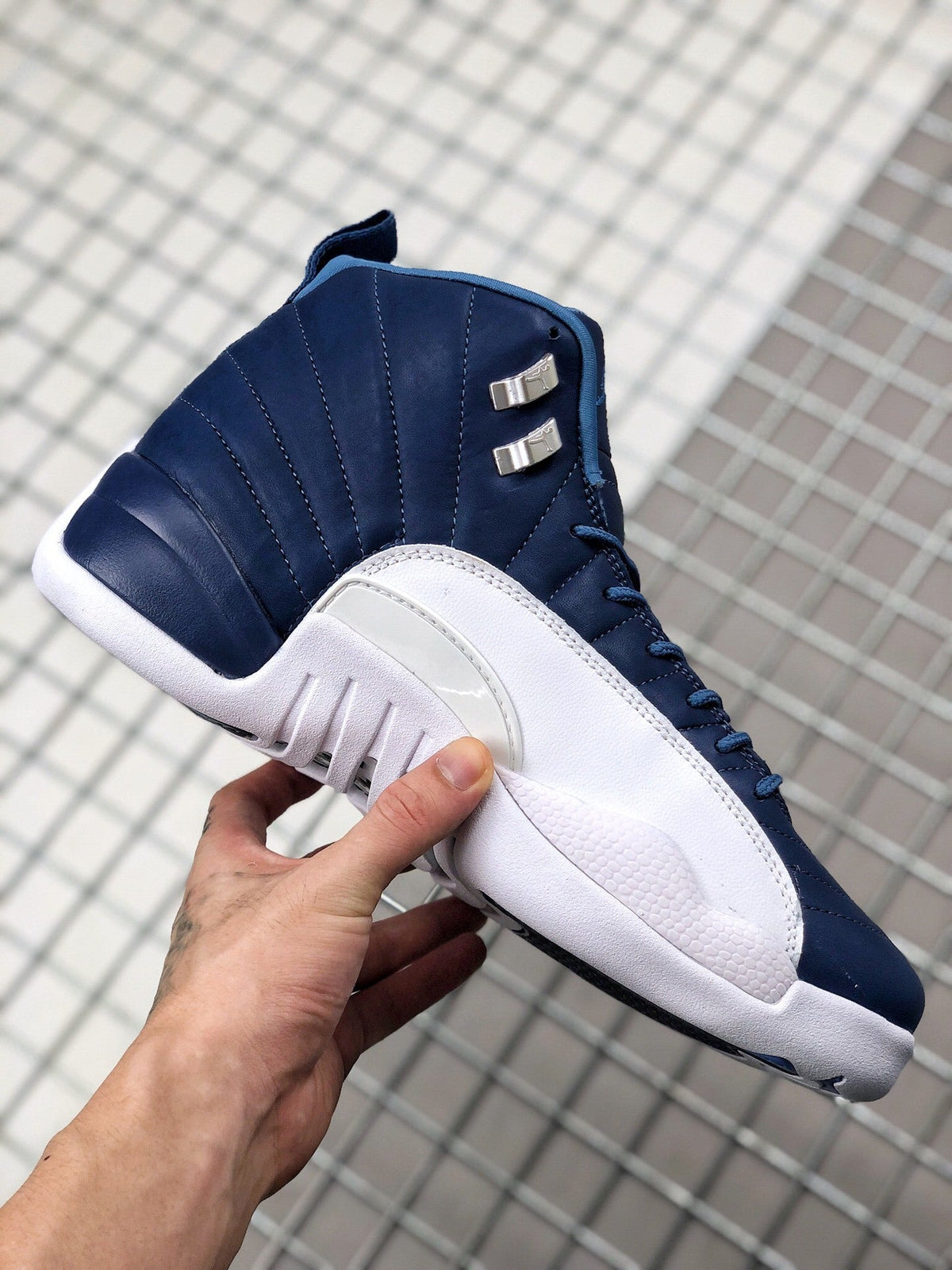 Air Jordan 12 Indigo Sneakers 130690-404 - product image from the listing.