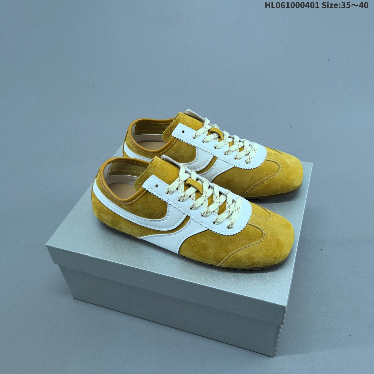 Women's GG Yellow and White Suede-Style Lace-Up Sneakers - product image from the listing.