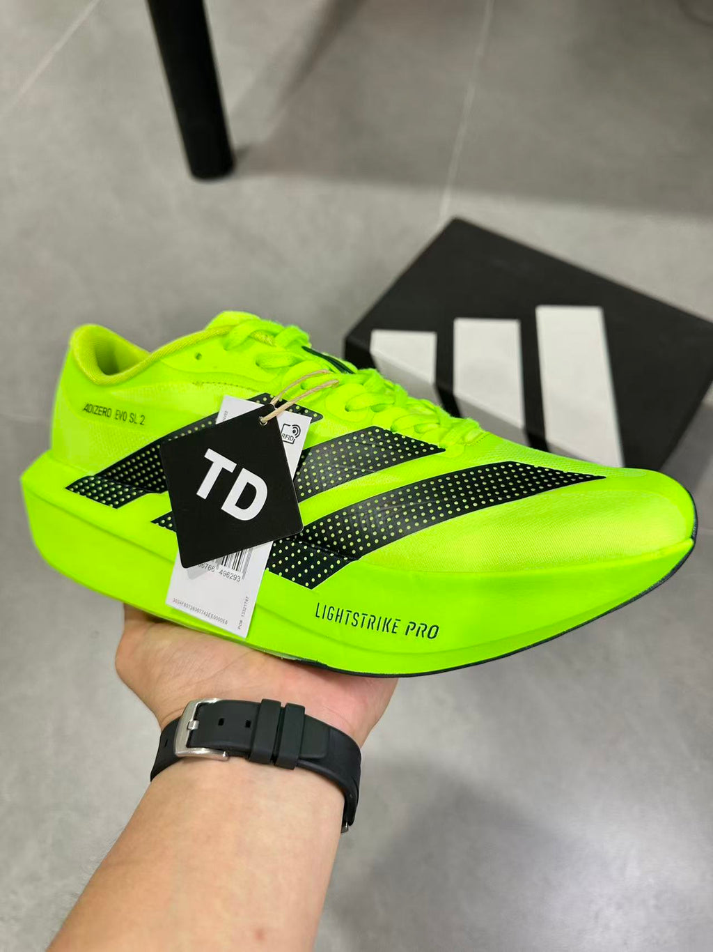 adidas Adizero Evo SL 2 Neon Running Shoes in Yellow - product image from the listing.