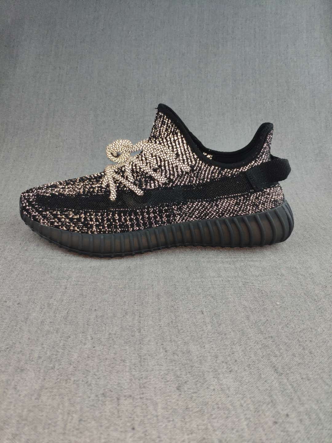Black and Cream Yeezy 350 V2 Knit Sneakers - product image from the listing.