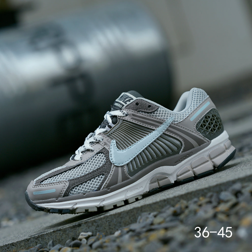 Grey Nike Air Zoom Vomero 5 Running Shoes - product image from the listing.