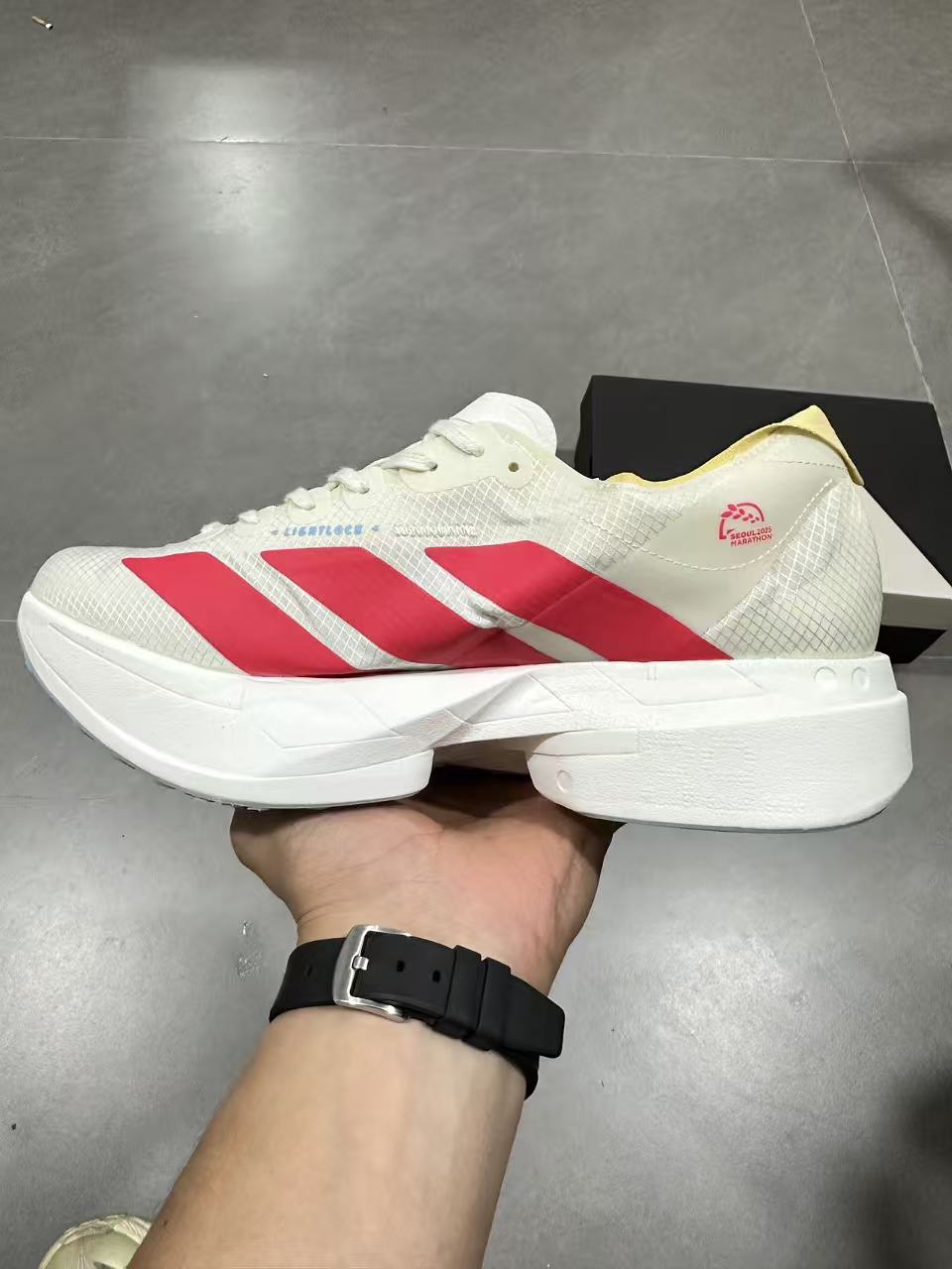 adidas Lightstrike Pro Running Shoes in White Red JR4542 - product image from the listing.