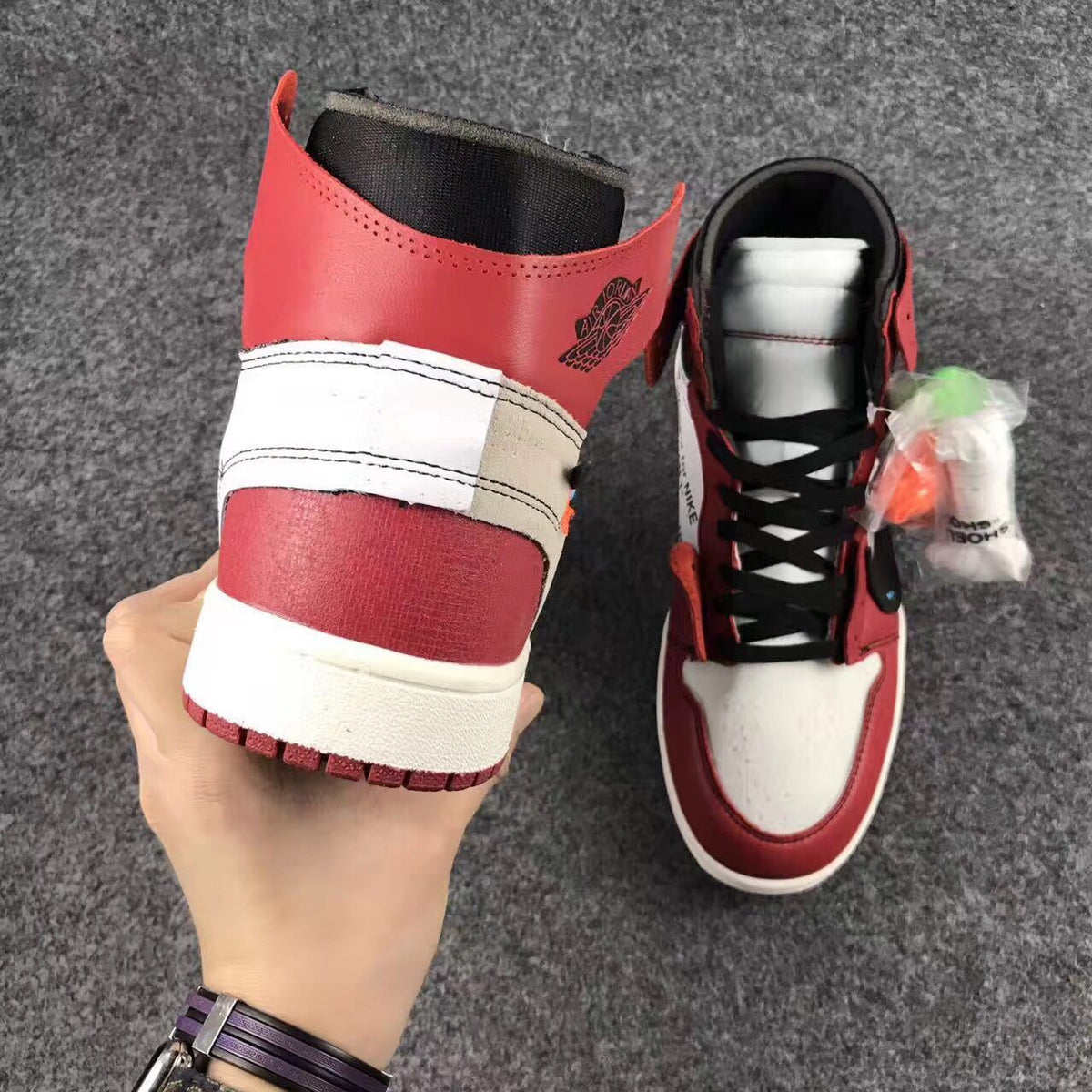 Off-White x Air Jordan 1 High Sneakers, in Red and White - product image from the listing.