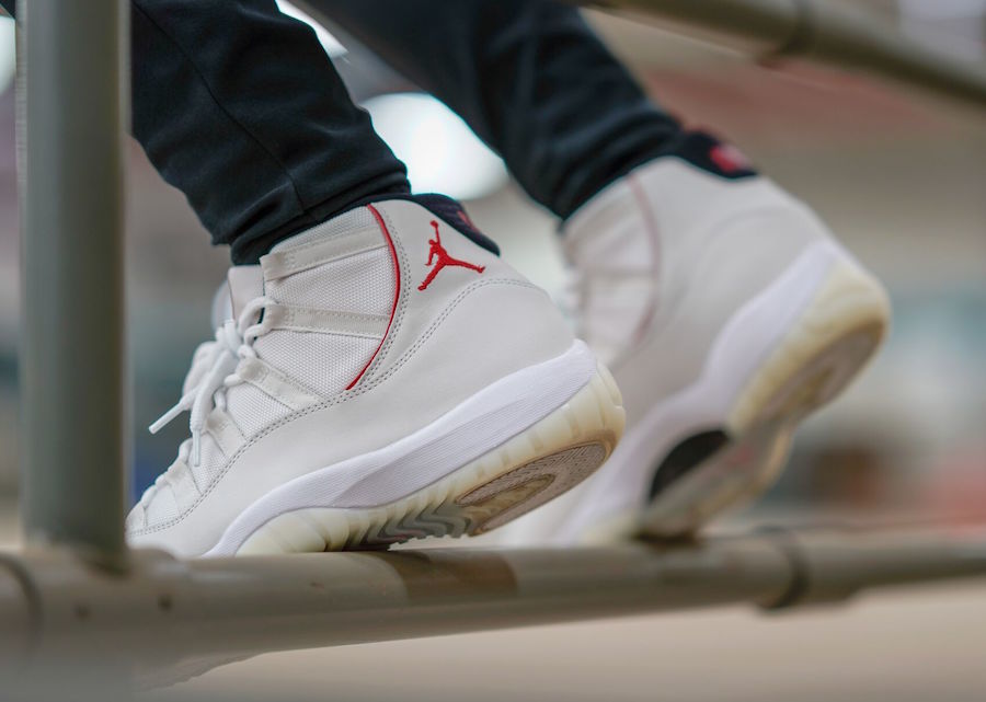 Air Jordan 11 Platinum Tint White High-Top Sneakers - product image from the listing.
