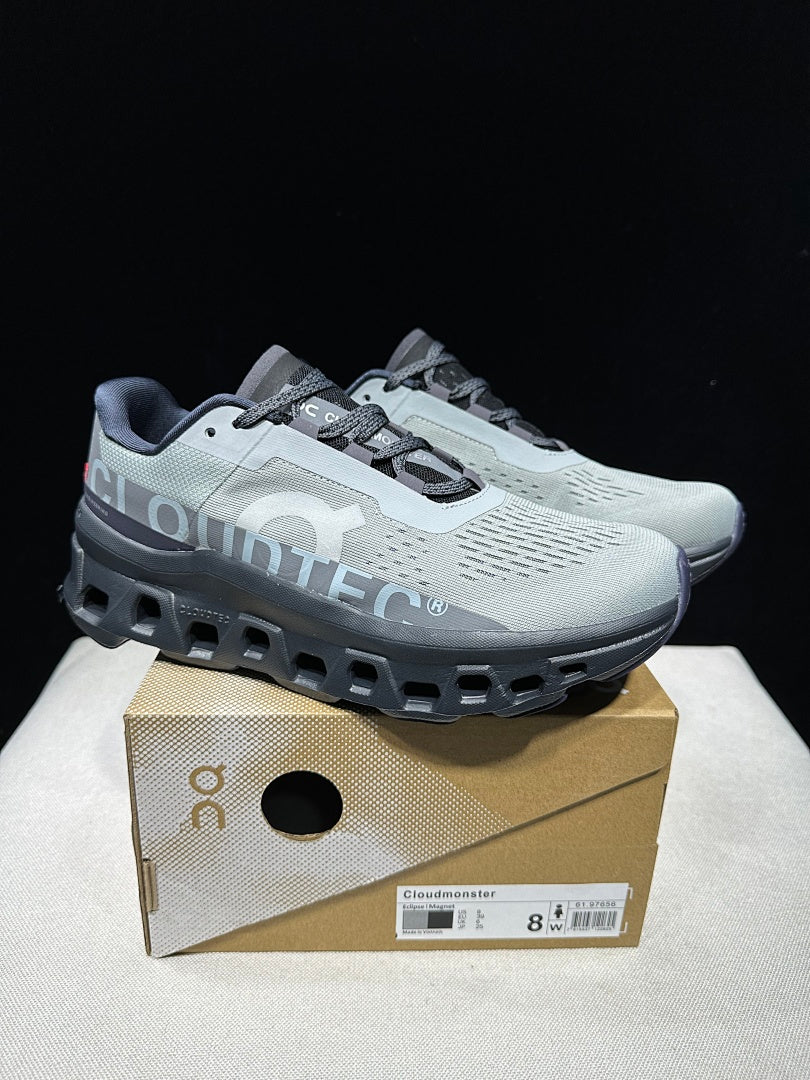 On Cloudmonster Shoes for Running in Eclipse and Magnet - product image from the listing.