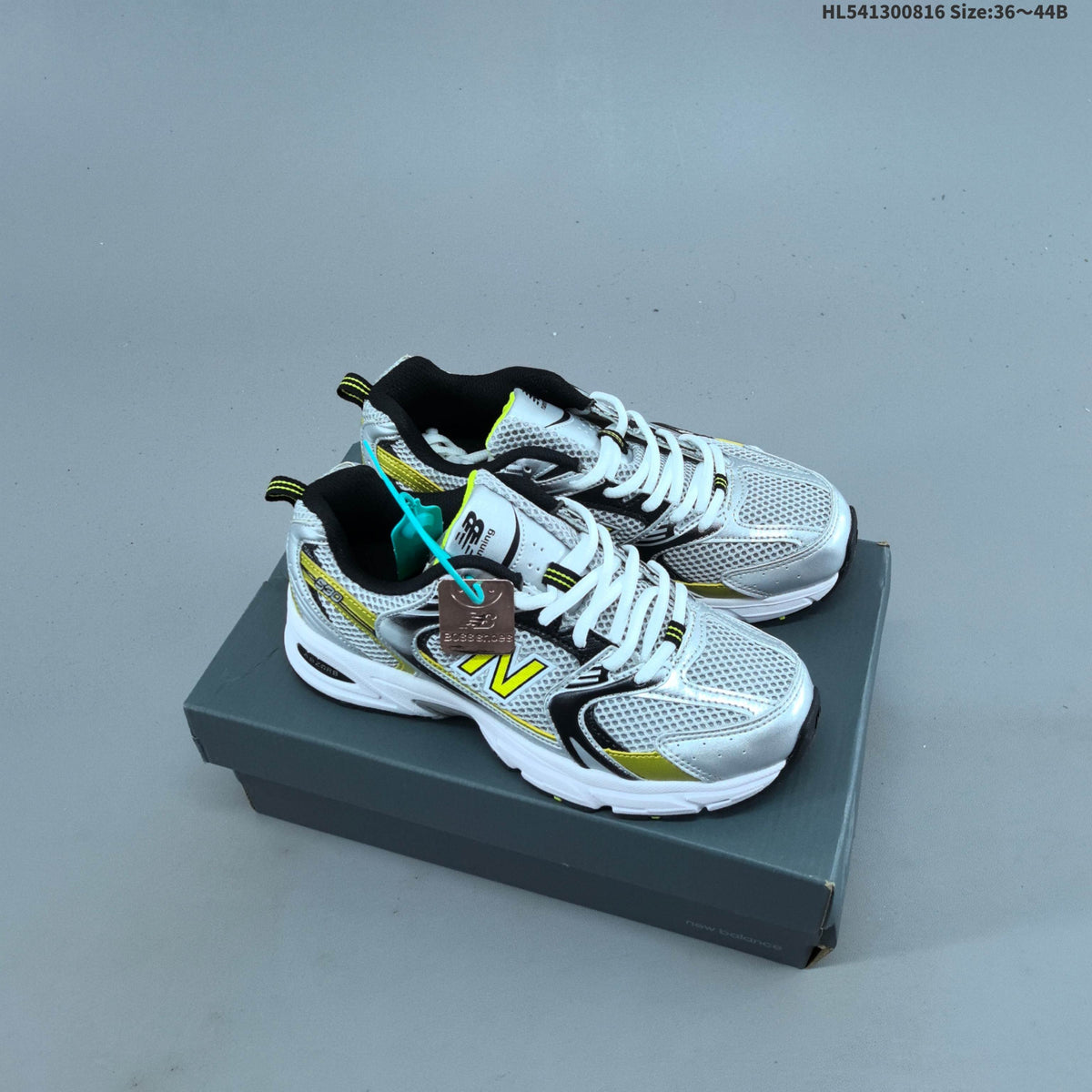 White and Silver New Balance 530-Style Mesh Sneakers - product image from the listing.