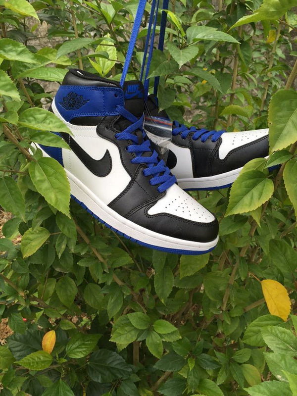 Jordan 1 High Sneakers in Black, in White and Royal Blue - product image from the listing.