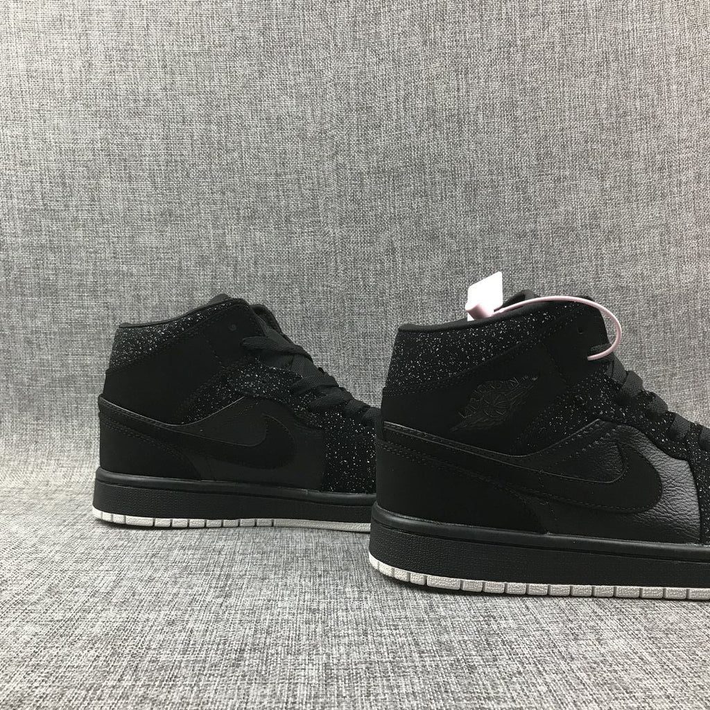 Air Jordan 1 Mid Black and White Sneakers 554724-001 - product image from the listing.