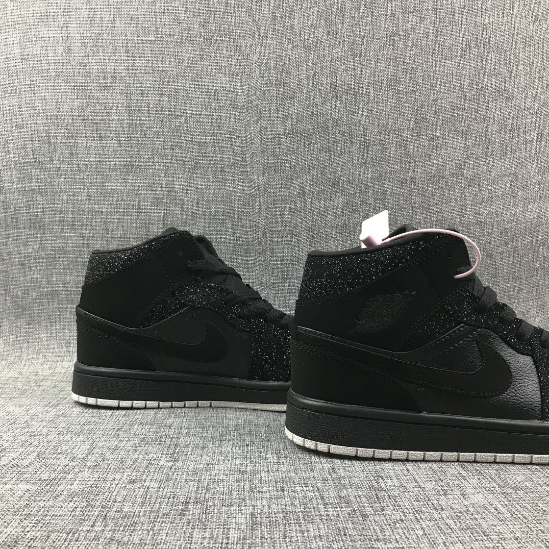 Air Jordan 1 Mid Black and White Sneakers 554724-001 - product image from the listing.