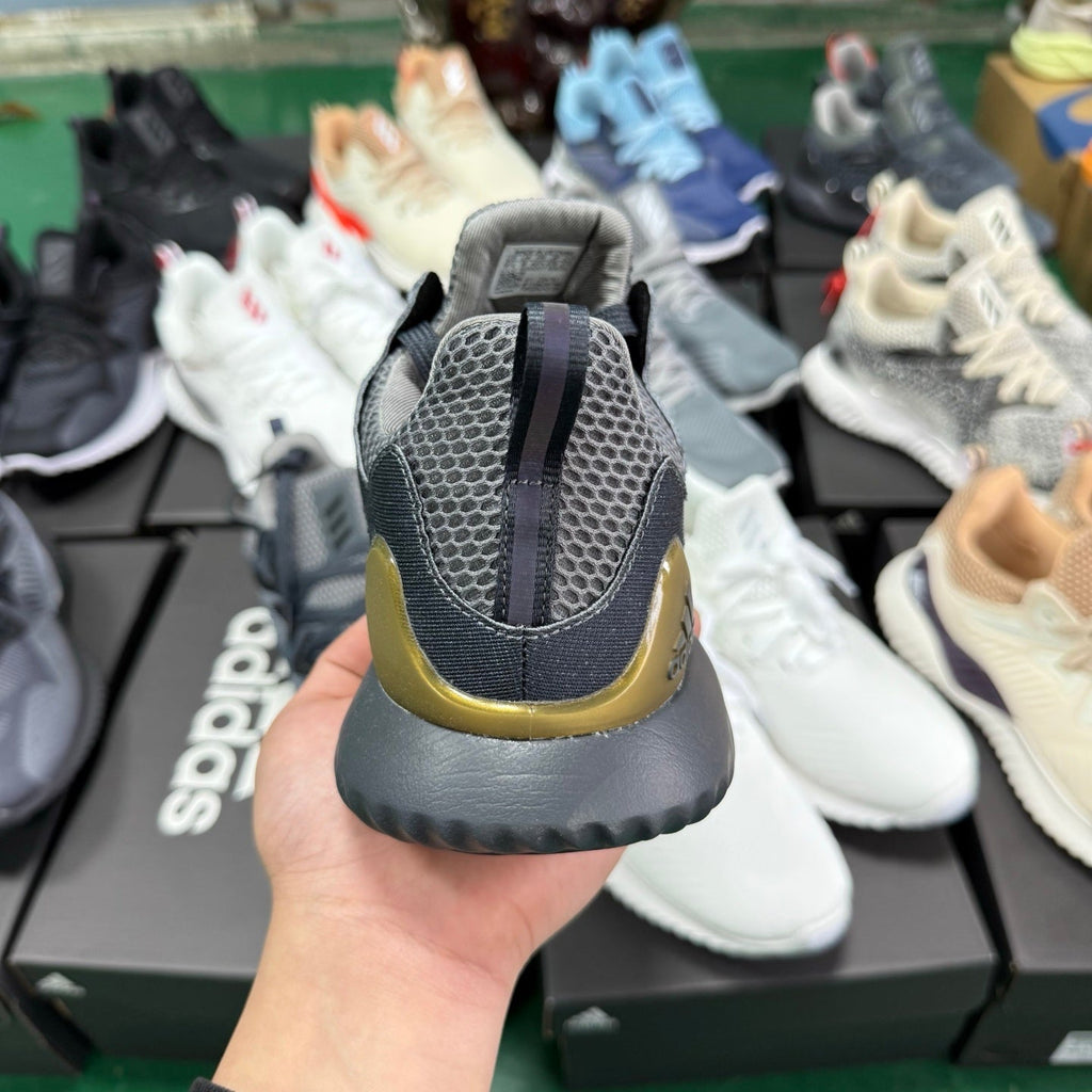 adidas Alphabounce CG4762 Sneakers, in Grey and Gold - product image from the listing.