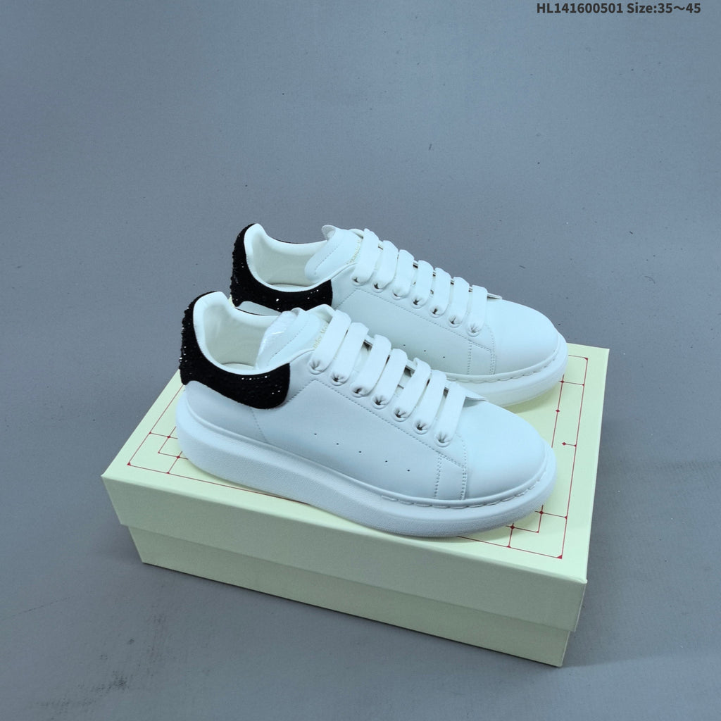 Alexander McQueen Oversized White Low-Cut Sneakers with Black Heel - product image from the listing.