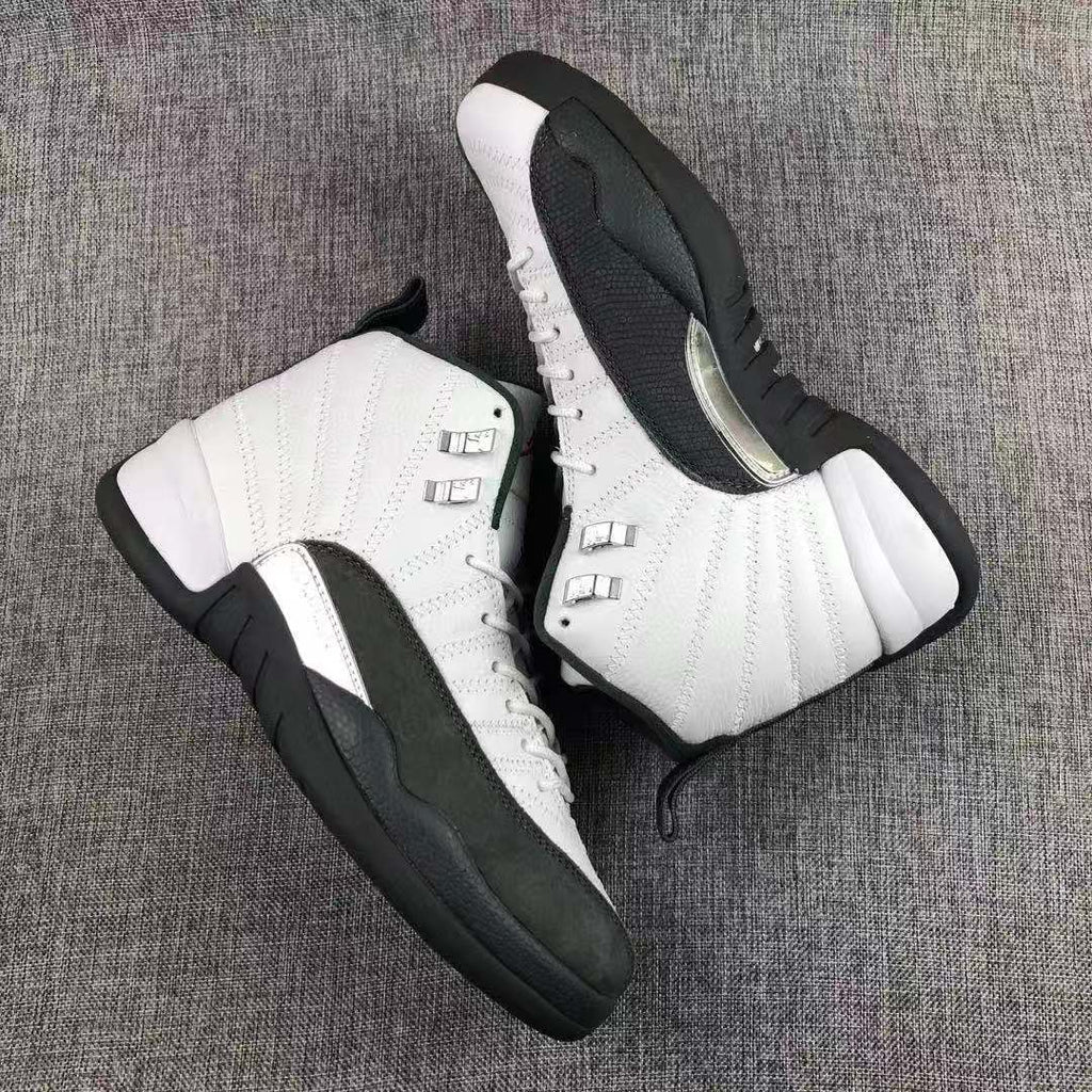 Air Jordan 12 Retro Taxi White Black Sneakers - product image from the listing.