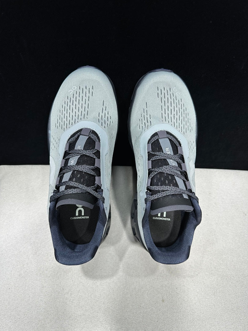On Cloudmonster Shoes for Running in Eclipse and Magnet - product image from the listing.