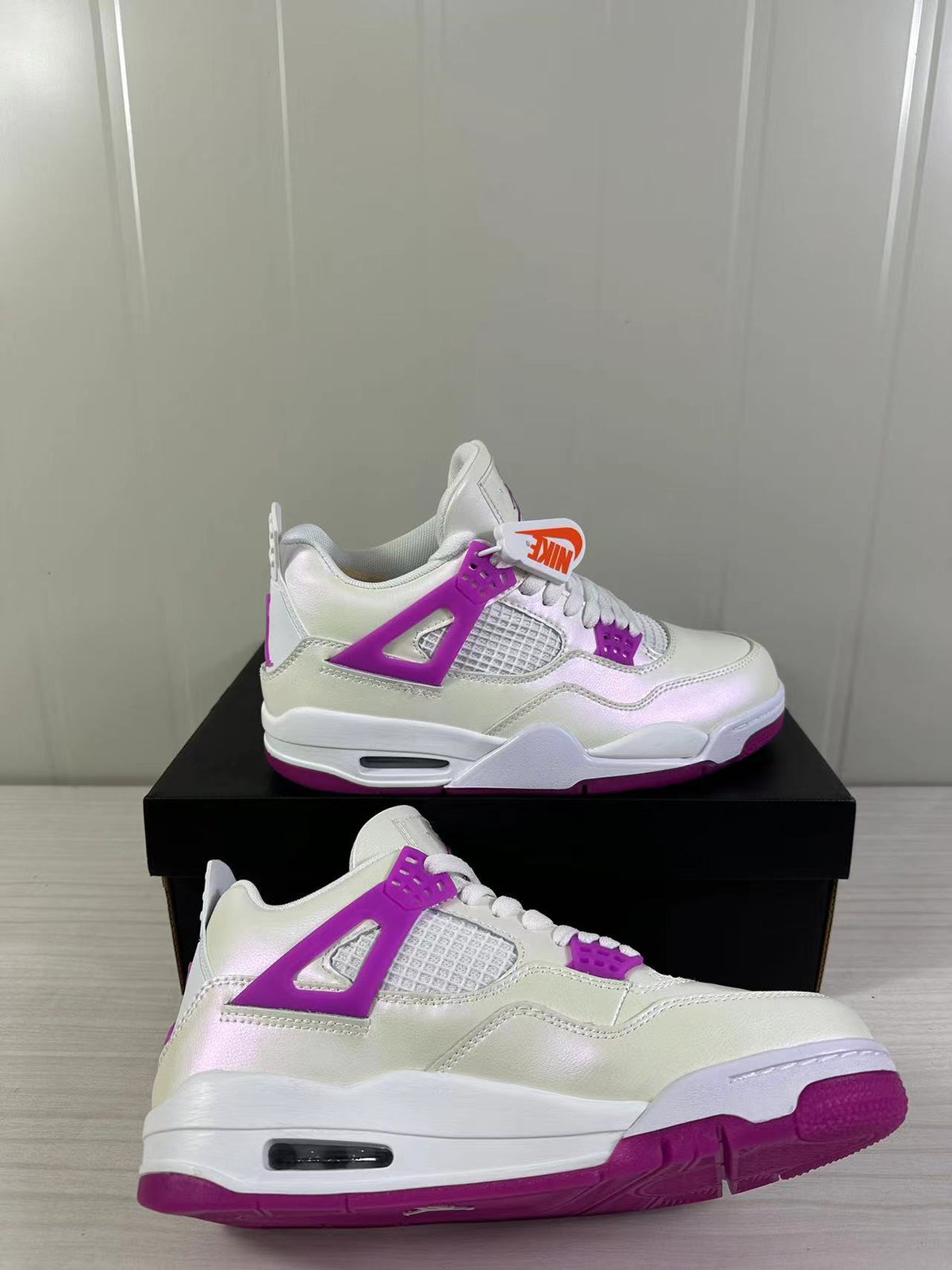 Air Jordan 4 Retro Hyper Violet Sneakers FQ1314-151 - product image from the listing.