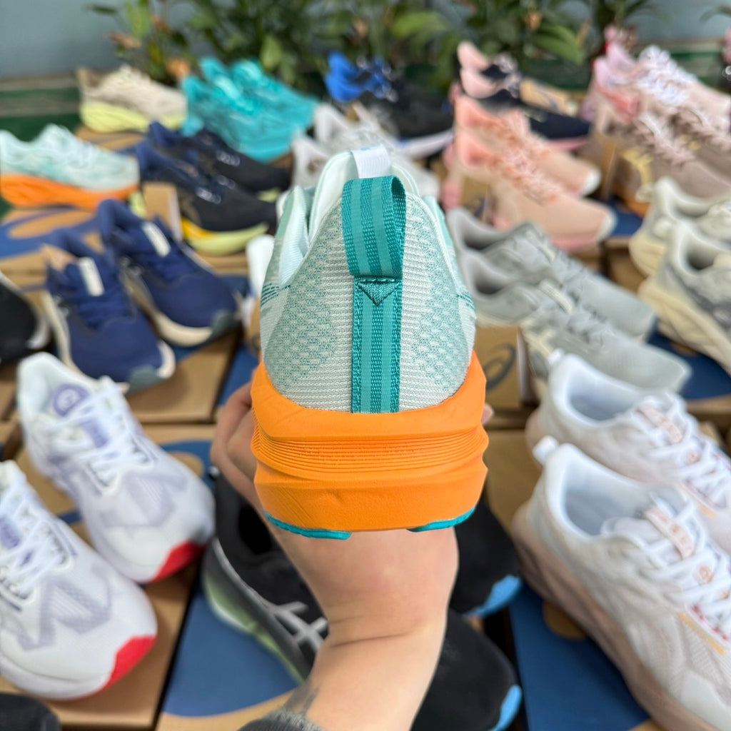 ASICS NOVABLAST 5 LE Running Shoes in White Orange - product image from the listing.