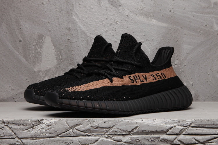 Yeezy Boost 350 V2 Sneakers in Black and Tan - product image from the listing.