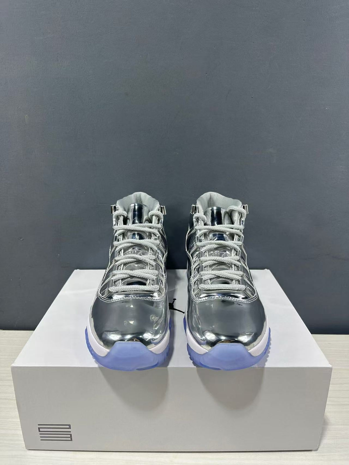 Air Jordan 11 Retro Liquid Silver High-Top Sneakers - product image from the listing.