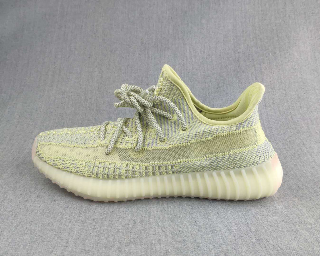 Pale Yellow and Gray Yeezy 350 V2 Knit Sneakers - product image from the listing.