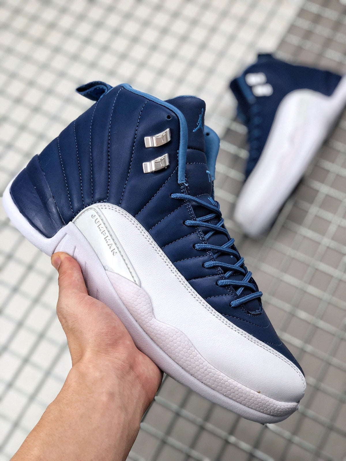 Air Jordan 12 Indigo Sneakers 130690-404 - product image from the listing.