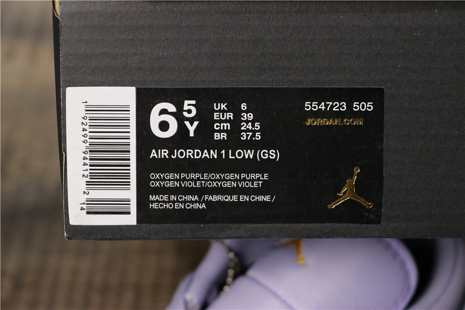 Air Jordan 1 Low GS Oxygen Sneakers in Purple 554723-505 - product image from the listing.
