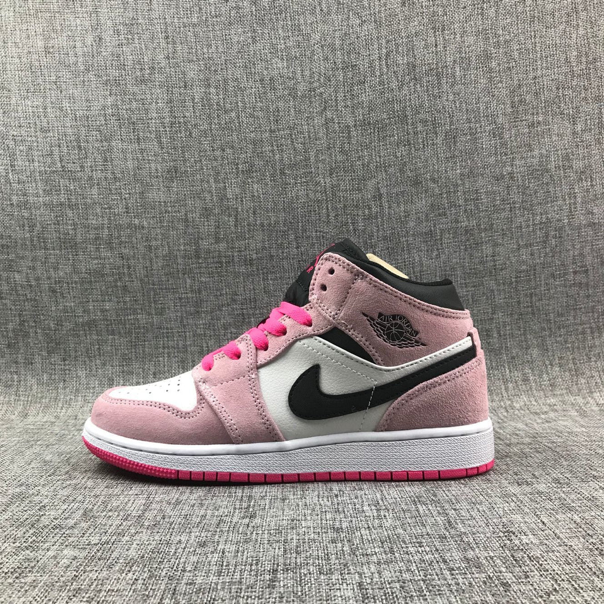 Jordan 1 Mid Sneakers in Pink White Black 852542-801 - product image from the listing.