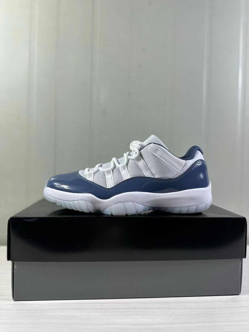 Air Jordan 11 Low Diffused Blue Sneakers FV5104-104 - product image from the listing.